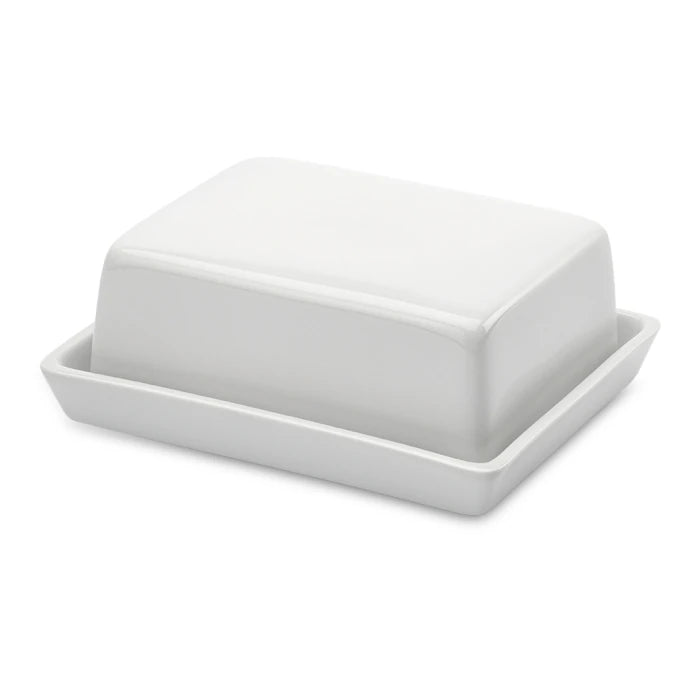 Stor DORA porcelæns smørskål med glat overflade og rund form, perfekt til servering af smør.
