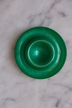 Green Heim Söhne egg cup with a smooth ceramic finish, designed for holding a single boiled egg.
