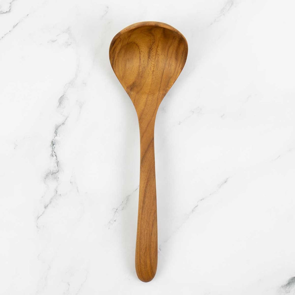 Redskab teak kitchen spoon from A World of Craft, handcrafted wooden utensil with a smooth handle and practical design.