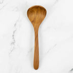 Redskab teak kitchen spoon from A World of Craft, handcrafted wooden utensil with a smooth handle and practical design.