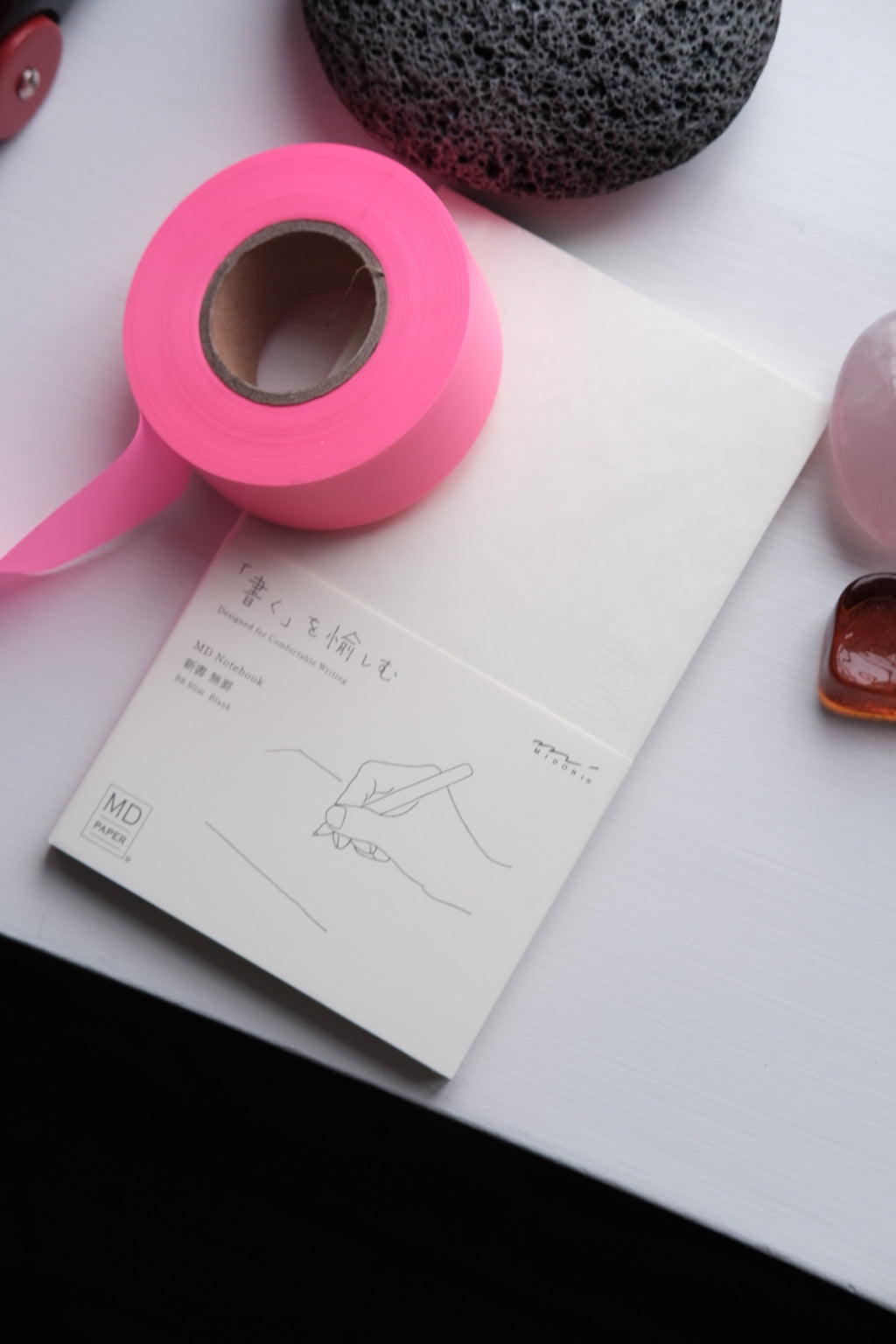 Midori B6 blank notesbook with soft cover and white pages, ideal for writing and note-taking.