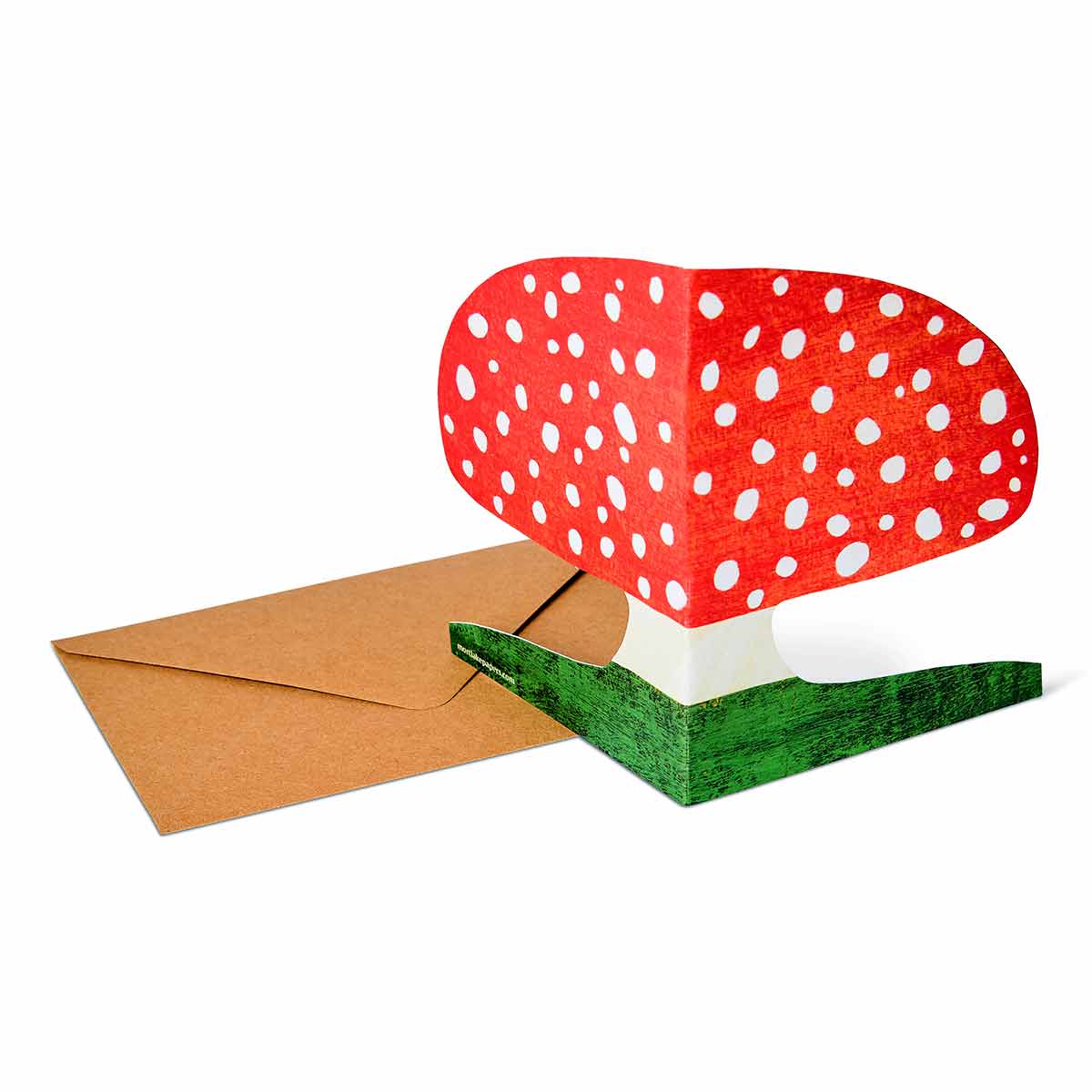 Kort featuring red fly agaric mushrooms, designed by Mortlake Papers, with vibrant red caps and white stems on textured paper background.