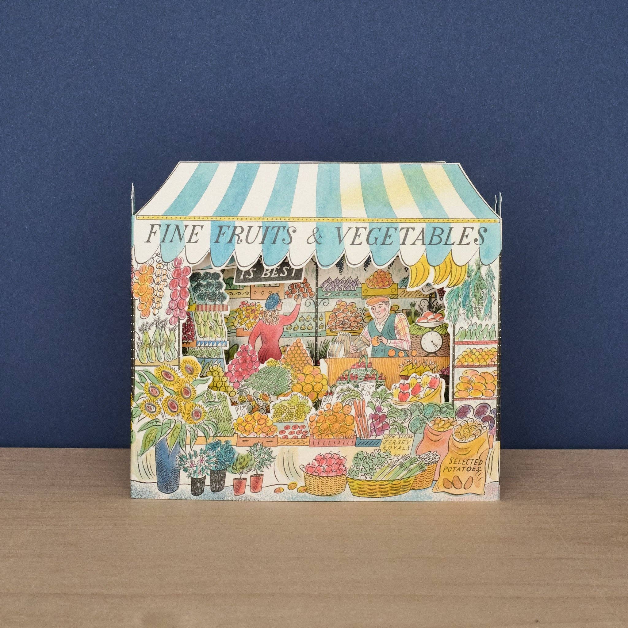 Art Angels Kort Grønthandler featuring vibrant vegetable illustrations on a textured background.