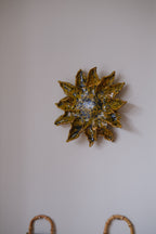 Handmade sunflower art object by Emilie Holm Atelier featuring a detailed, textured sunflower decoration.