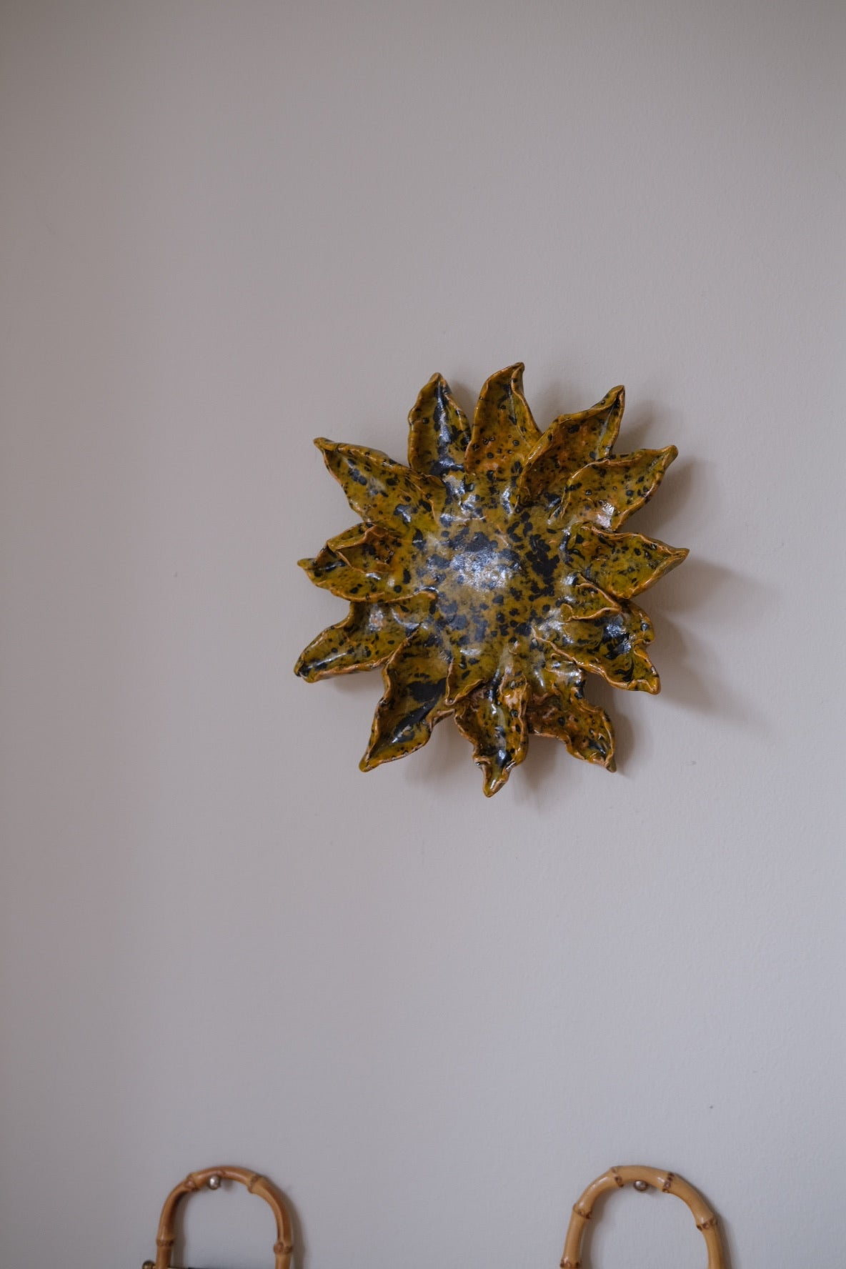Handmade sunflower art object by Emilie Holm Atelier featuring a detailed, textured sunflower decoration.