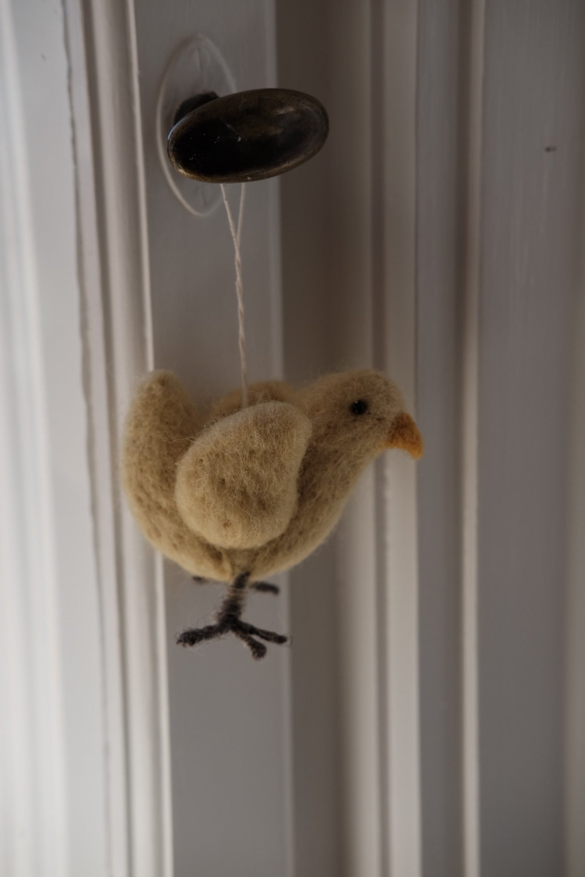 Decorative Easter chicken made of wool by Gamcha, featuring bright colors and intricate details for spring holiday decor.