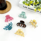 DORA light blue medium hair clip with a sleek design, perfect for securing hair in a stylish and functional way.