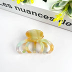 Pink DORA hair clip in a medium size, stylish hair accessory with a sleek design for securing hair comfortably.