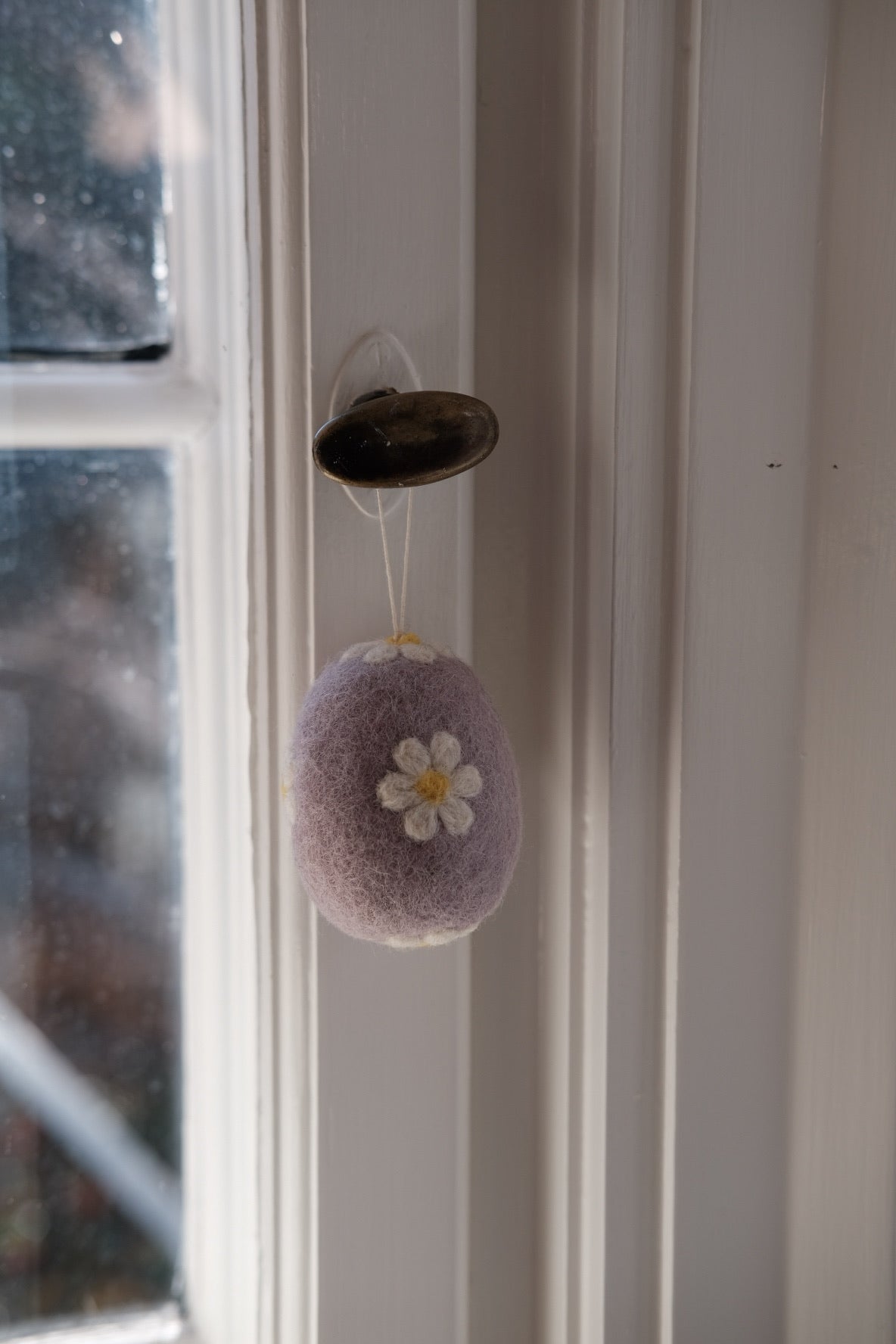 Colorful Gamcha Pynt egg made of wool, Easter decoration with vibrant woven design, perfect for spring holiday decor.