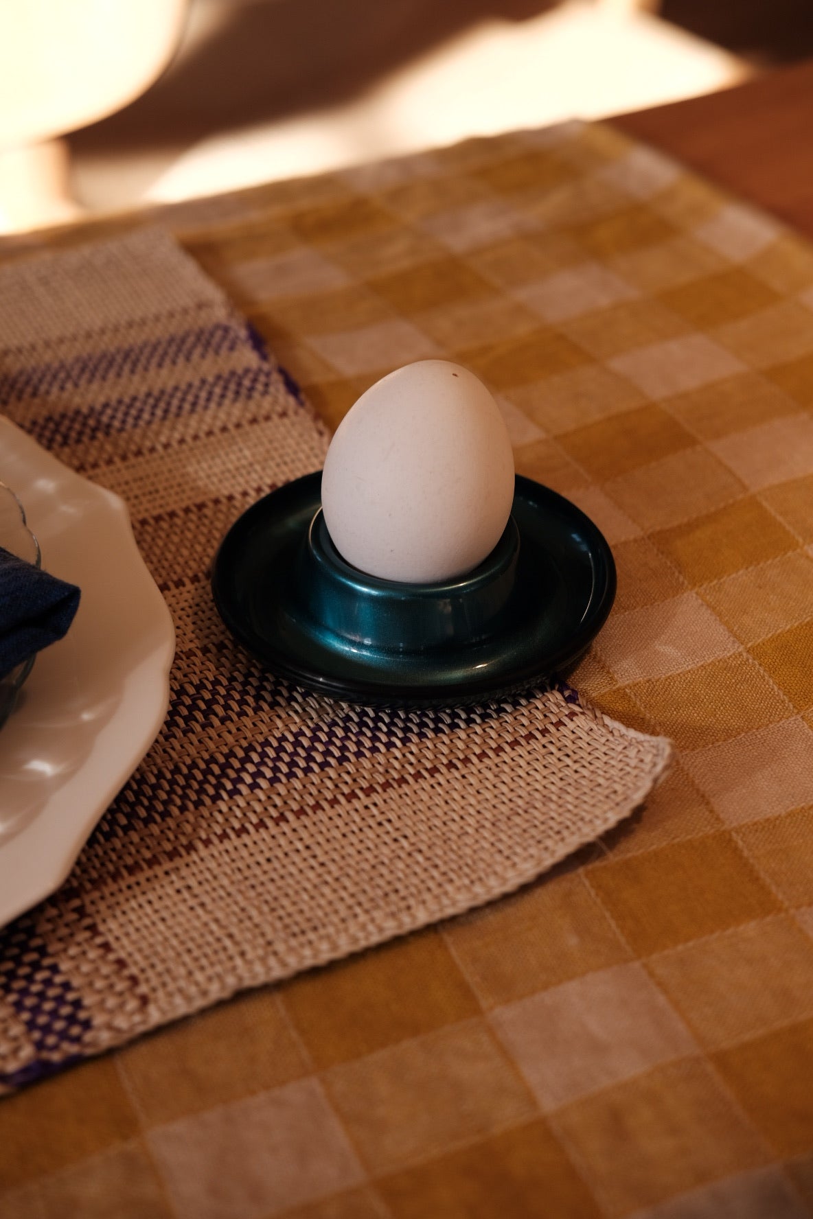 Heim Söhne petroleum egg cup, ceramic egg holder with a vintage design, featuring a smooth, glossy finish for breakfast serving.
