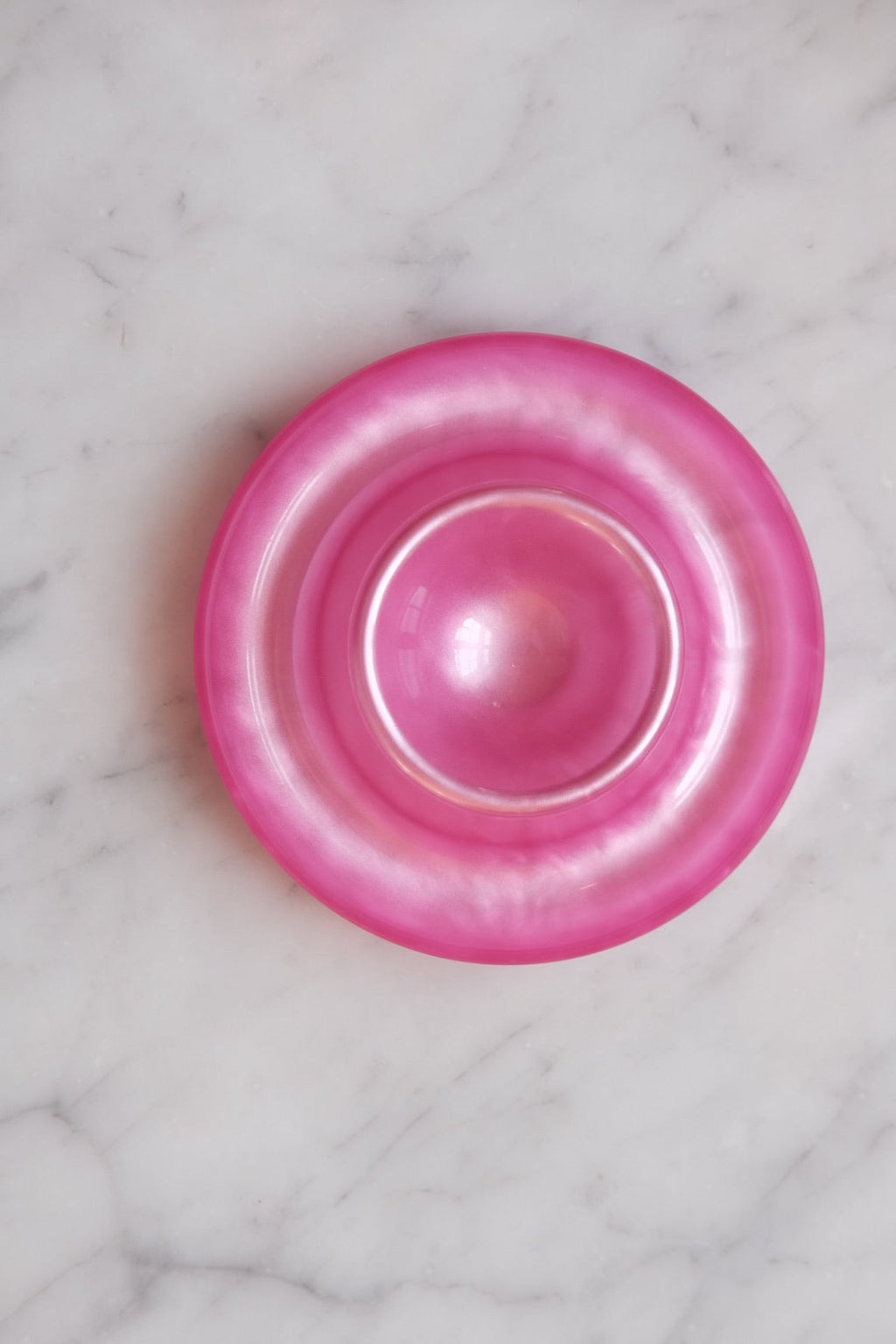 Pink Heim Söhne egg cup with smooth ceramic finish, designed for holding a boiled egg in a stylish breakfast setting.