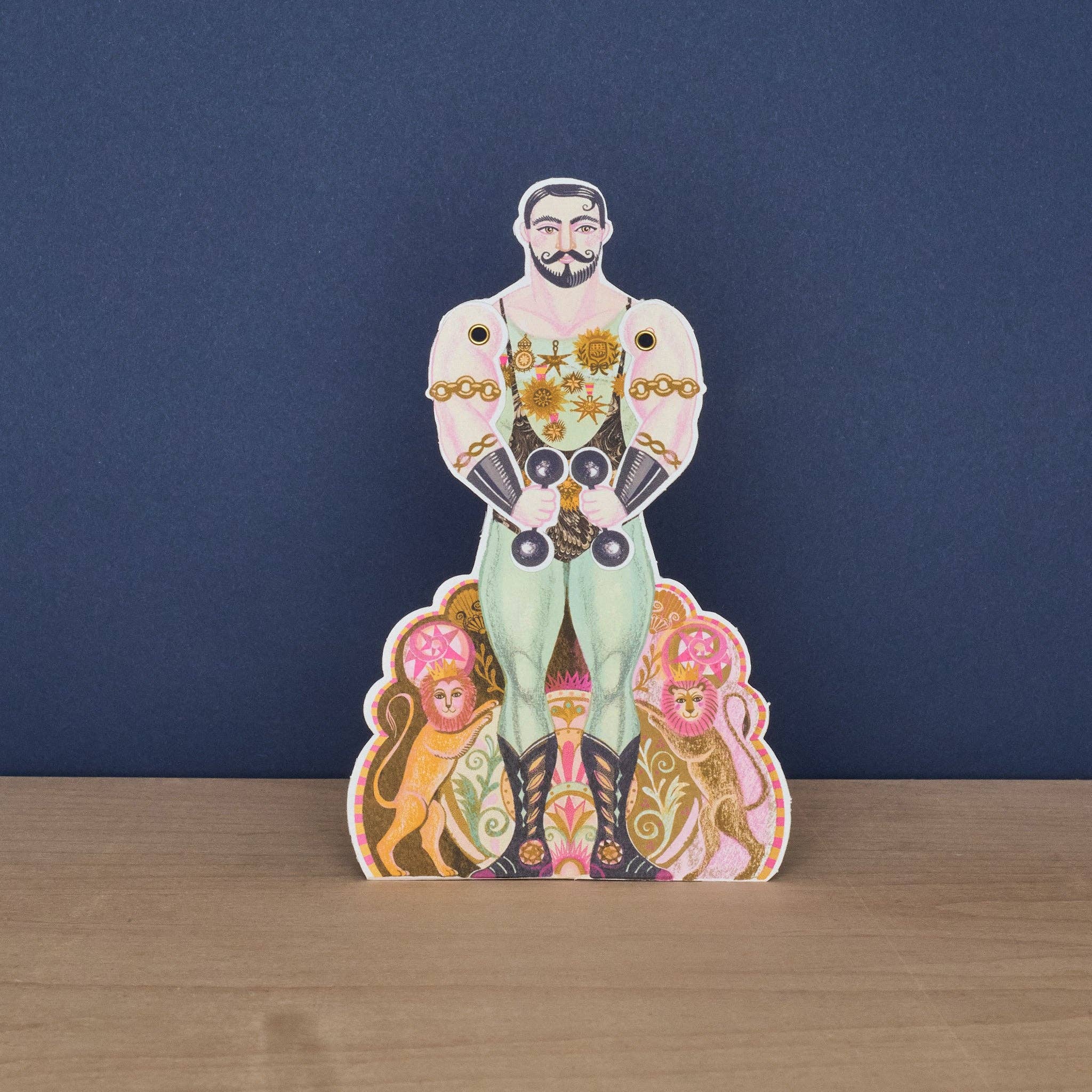 Kort fra Art Angels med stærk Alexander design, vist med detaljer og farver, perfekt til kortspil eller samling.