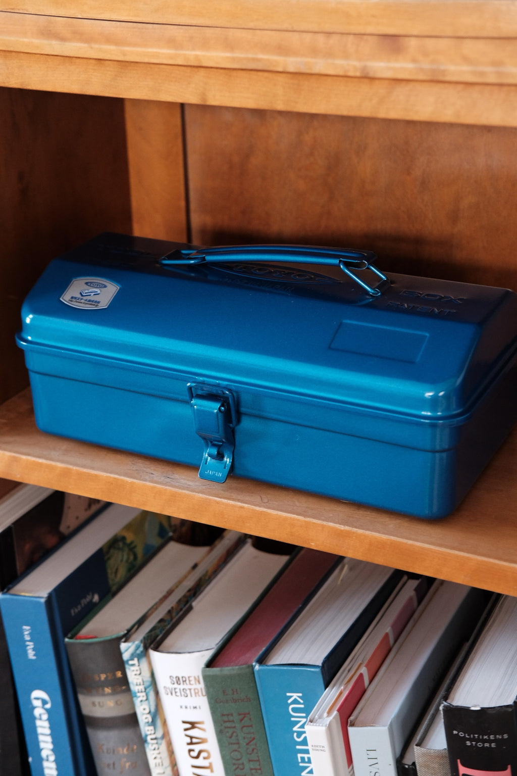 Blue Toyo Steel Co. Ltd storage box with Y 280 label, durable plastic storage container for organization and storage.