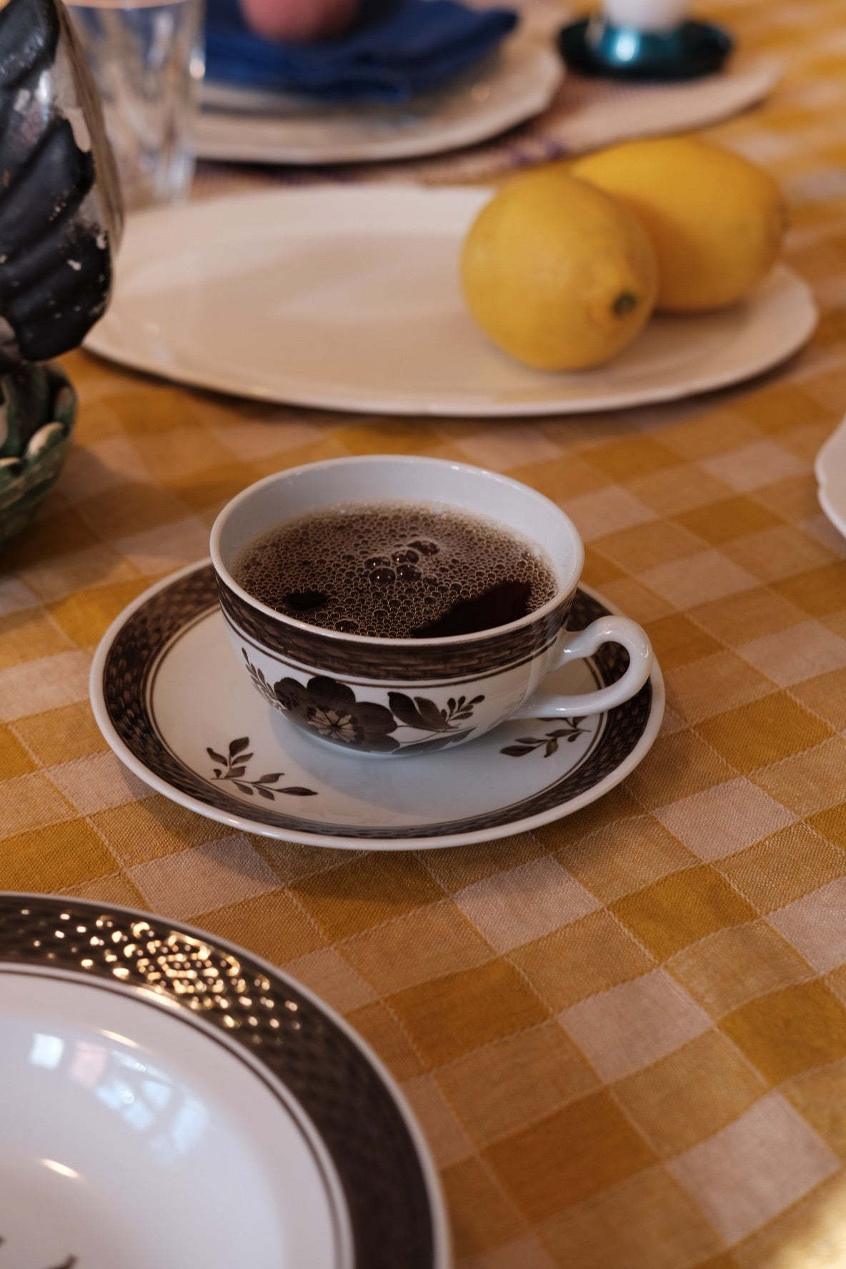 Vintage Royal Copenhagen Kop & Underskål set with 'Brun Morgenfrue' pattern, featuring detailed floral designs on ceramic cups and saucers.