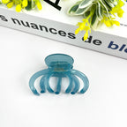 DORA light blue medium hair clip with a sleek, curved design, perfect for securing medium-length hair styles.