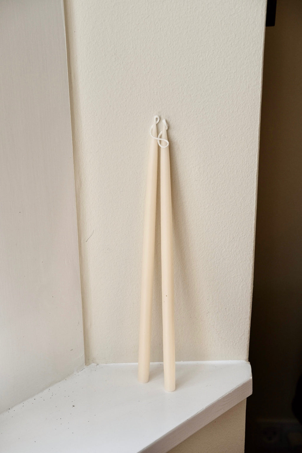 Set of four hand-dipped stearin candles in ivory, 28 cm tall, from Kunstindustrien, with natural wax texture and elegant design.