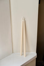 Set of four hand-dipped stearin candles in ivory, 28 cm tall, from Kunstindustrien, with natural wax texture and elegant design.