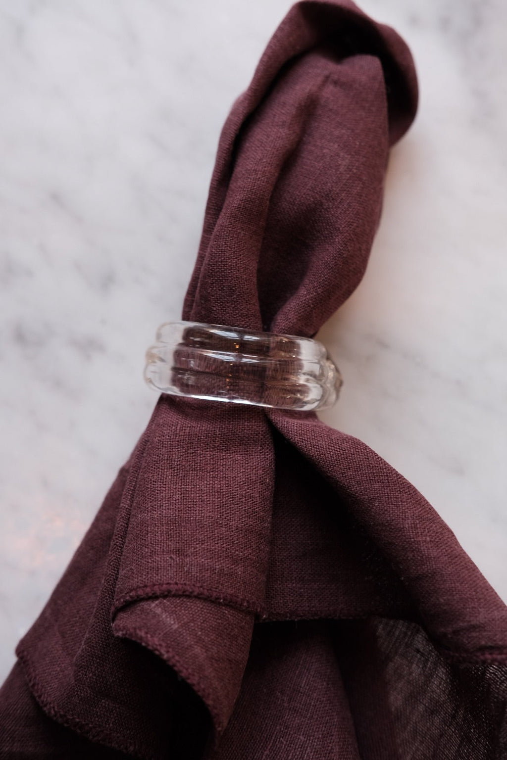 Set of two Marqversen Möglich blown glass napkin rings with clear, rounded design, perfect for elegant table settings.