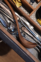 Redskab teak kitchen scoop from A World of Craft, made of durable teak wood, suitable for serving and cooking tasks.