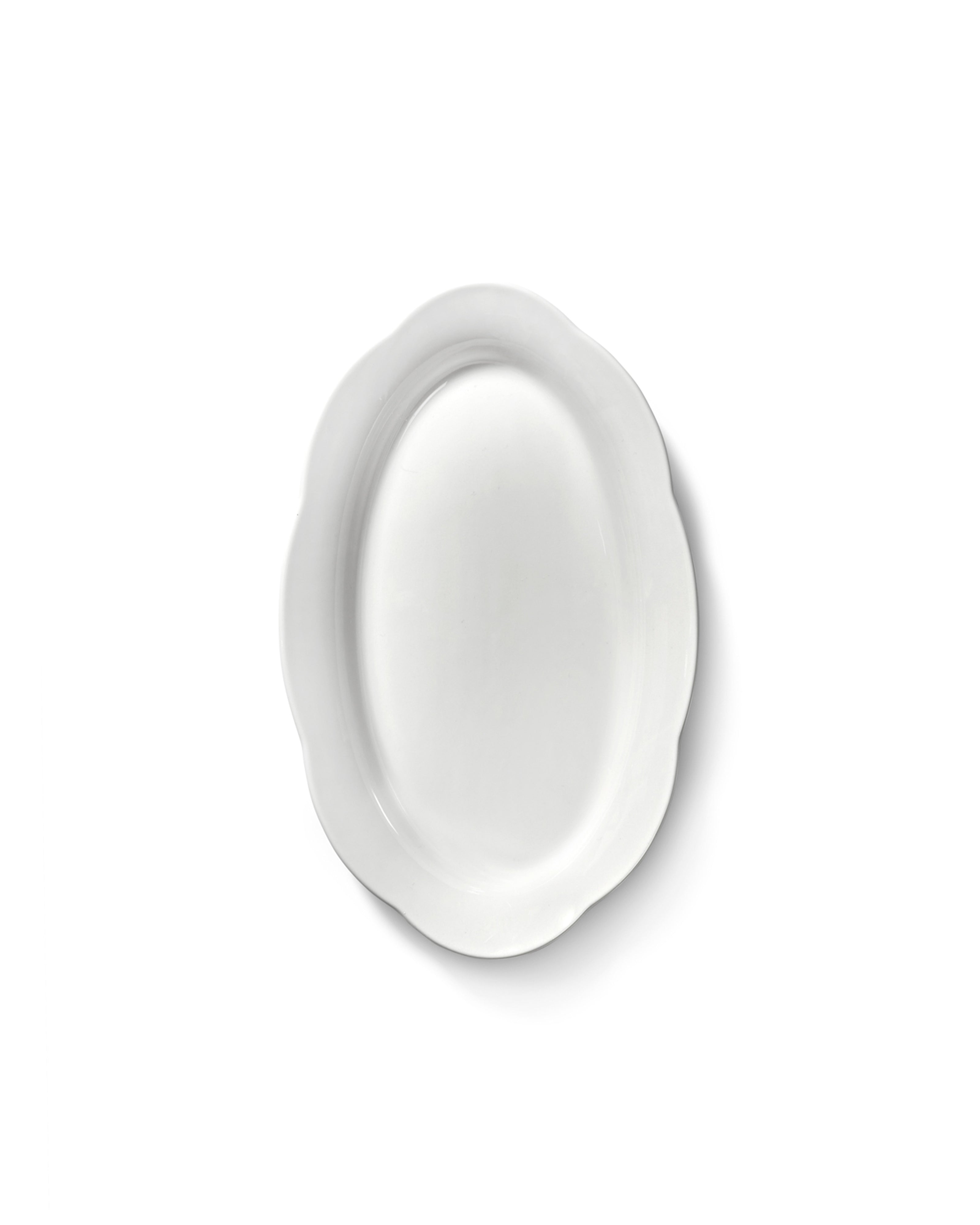 Dyb fad i silhouette-stil fra Serax, 24 cm, med elegant design og glat overflade, velegnet til dekoration eller servering.