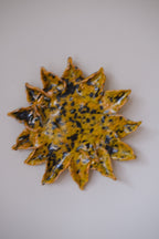 Handmade sunflower decoration by Emilie Holm Atelier, showcasing a detailed, artistic floral object with vibrant yellow petals.