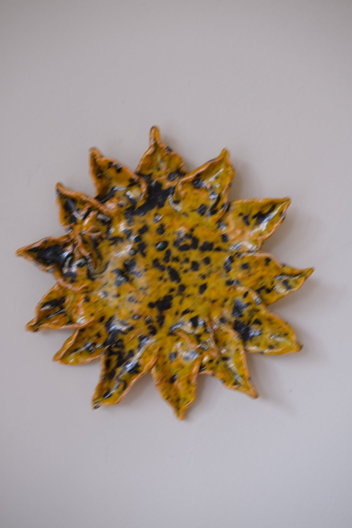 Handmade sunflower decoration by Emilie Holm Atelier, showcasing a detailed, artistic floral object with vibrant yellow petals.