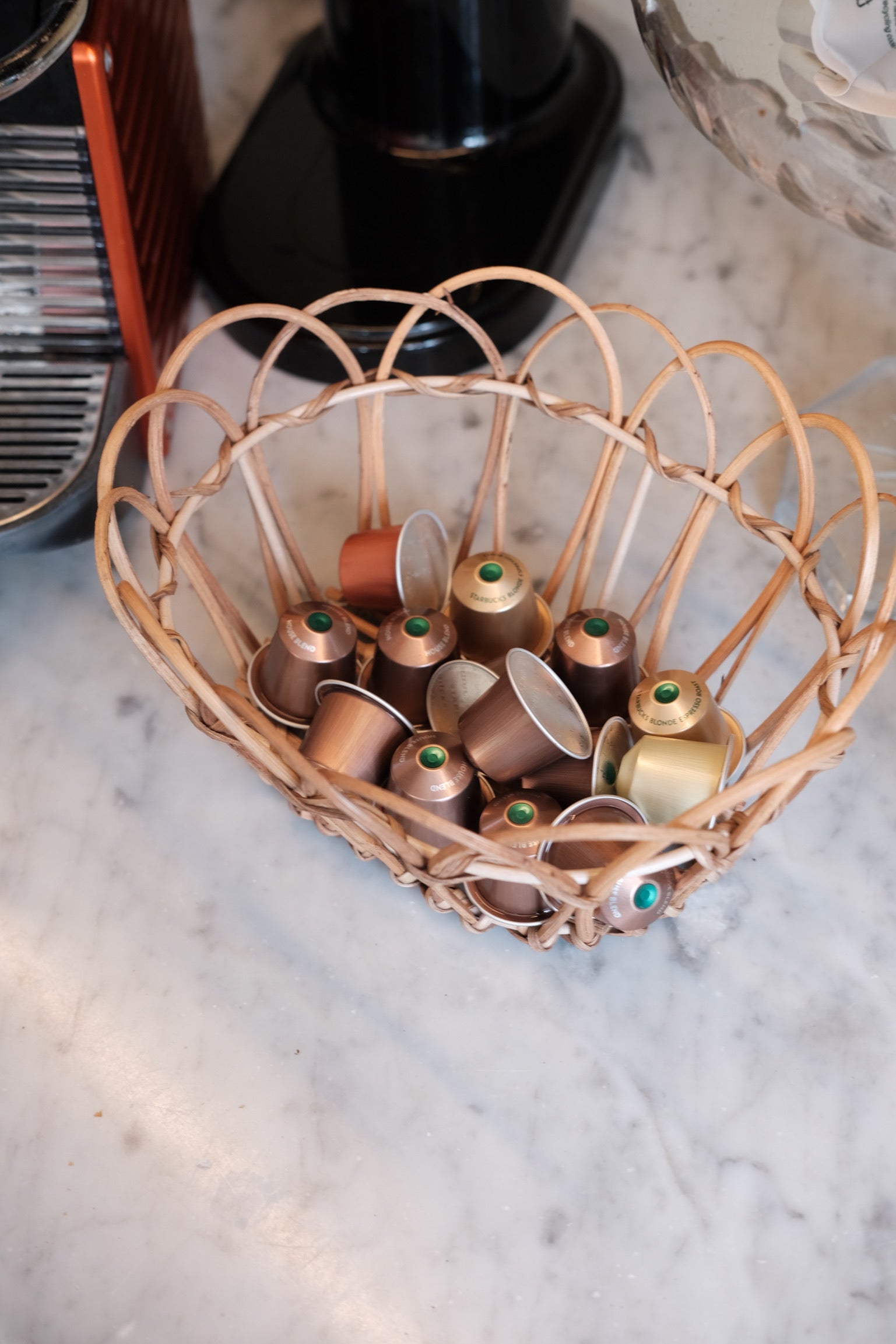 Small rattan bread basket by Bungalow, natural woven design, perfect for serving bread or baked goods.