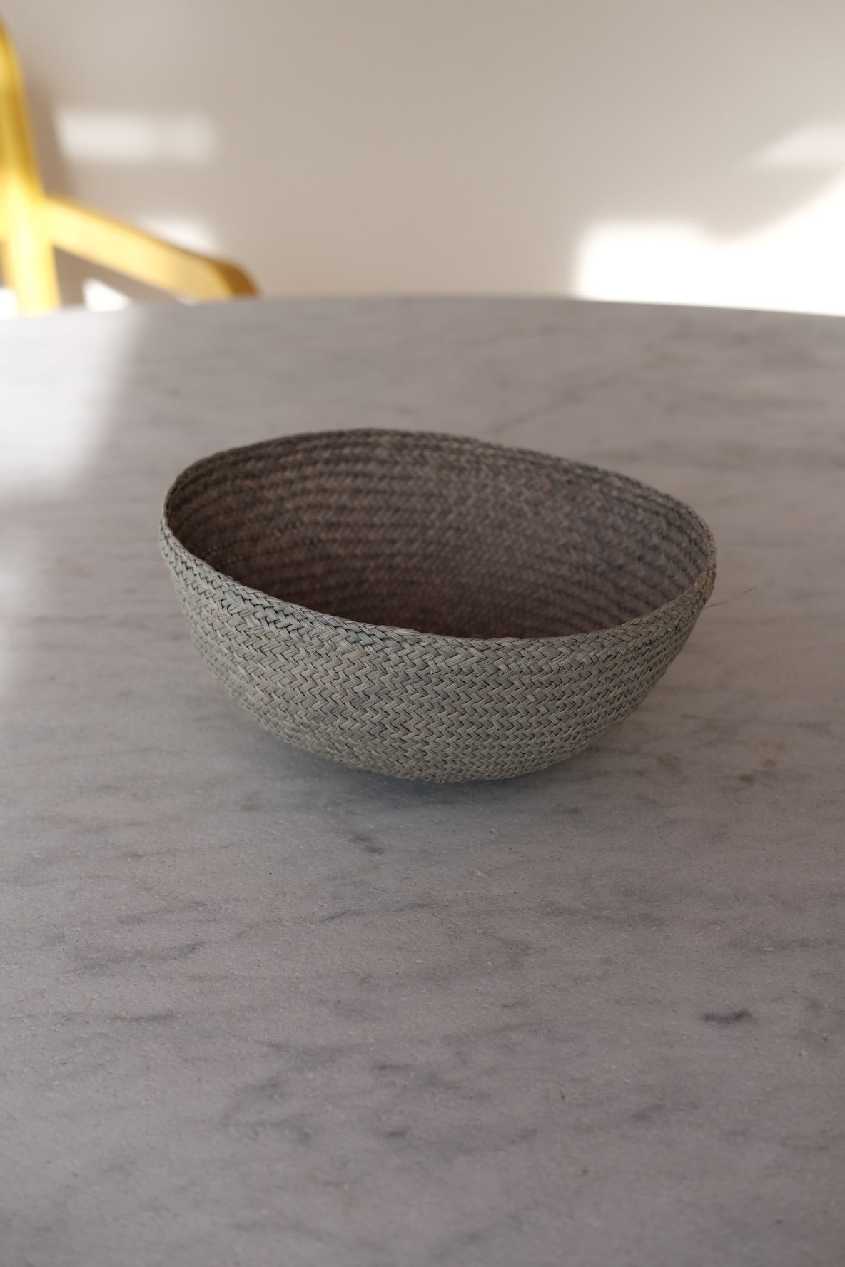 Mint green Guanabana Iraca palm leaf bowl with natural textures, perfect for decorative or functional use.