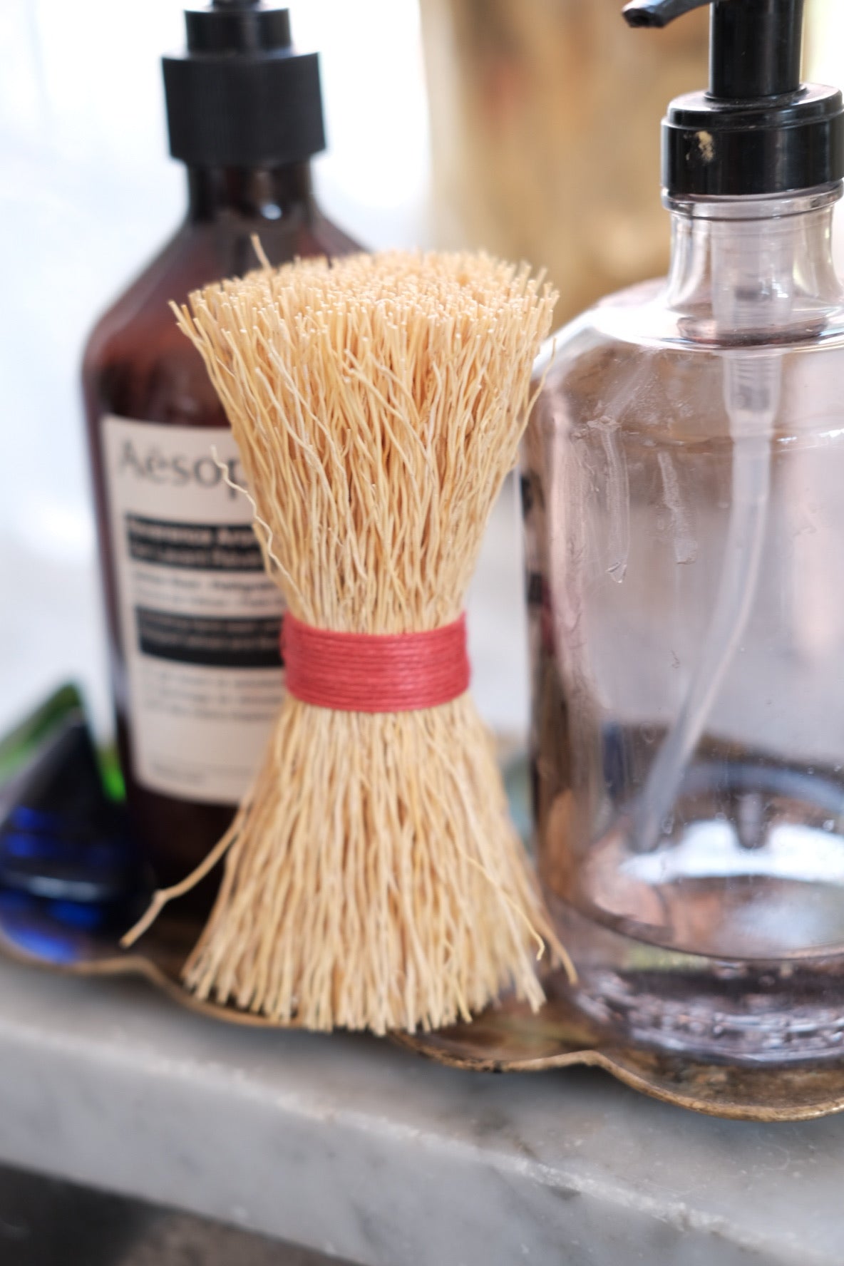 Red Iris Hantverk dish brush with a wooden handle and natural bristles, ideal for cleaning dishes and kitchenware.