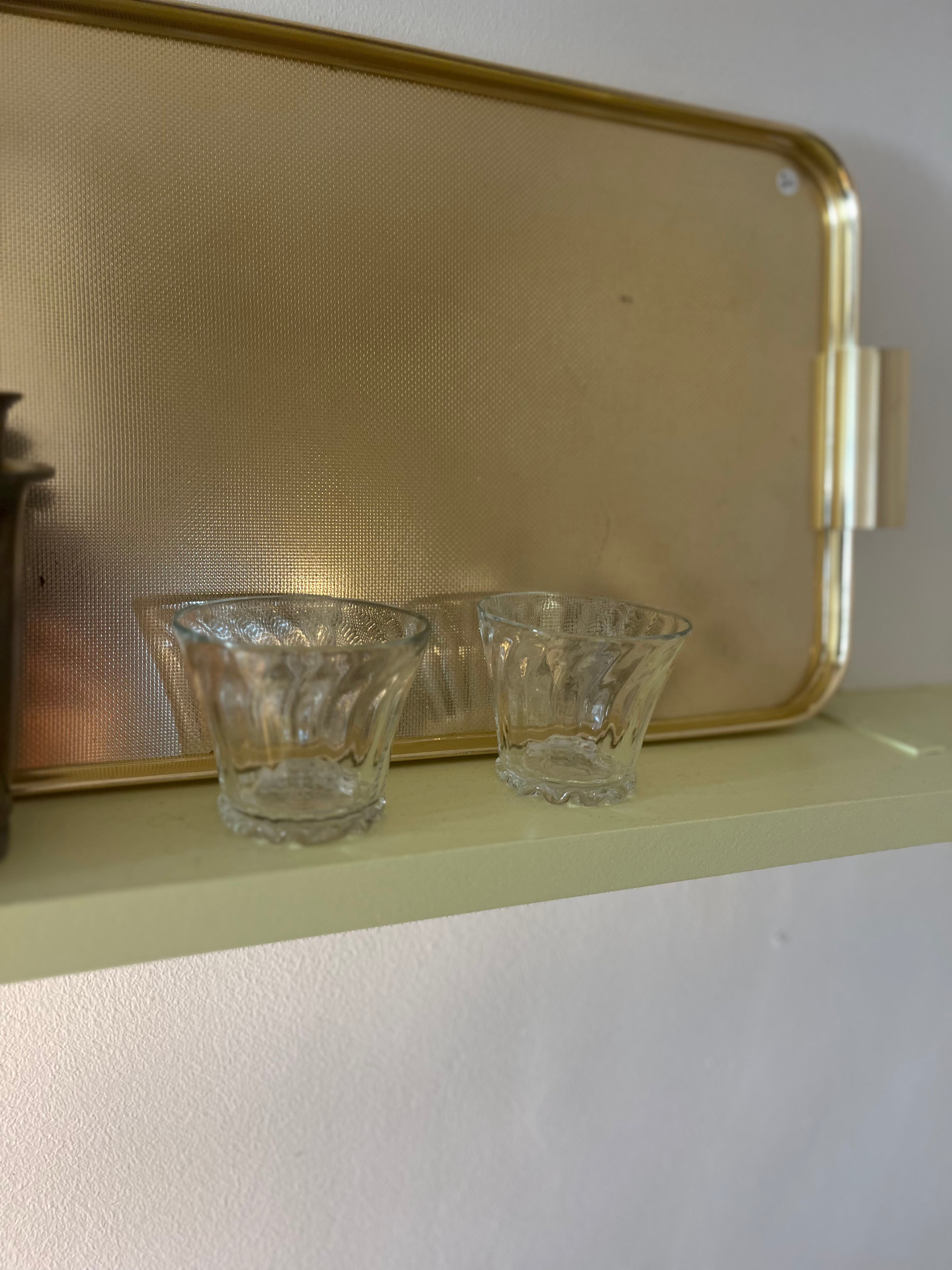 Clear hand-blown glass tumbler by Marqversen Möglich with a smooth, transparent surface and rounded shape.