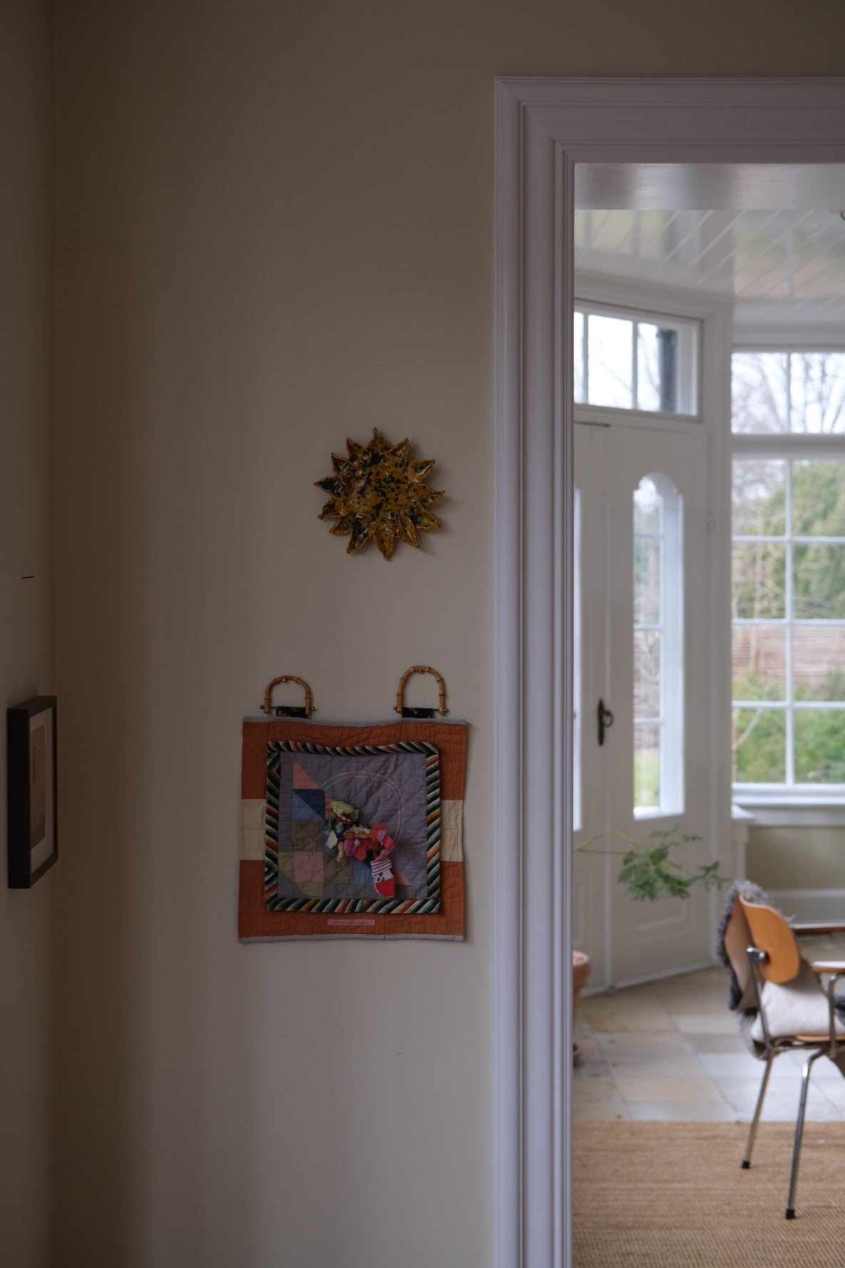 Handmade sunflower decoration by Emilie Holm Atelier, artistic object with detailed petal and center design.