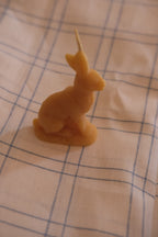 DORA Bivoks påskehare candle in a festive design, featuring a cute bunny shape and vibrant colors for Easter celebration.