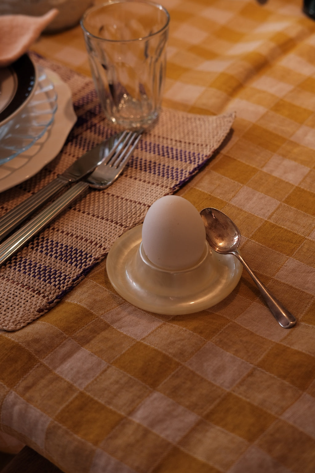 Cream-colored Heim Söhne egg cup with a smooth, rounded design and simple elegant style.