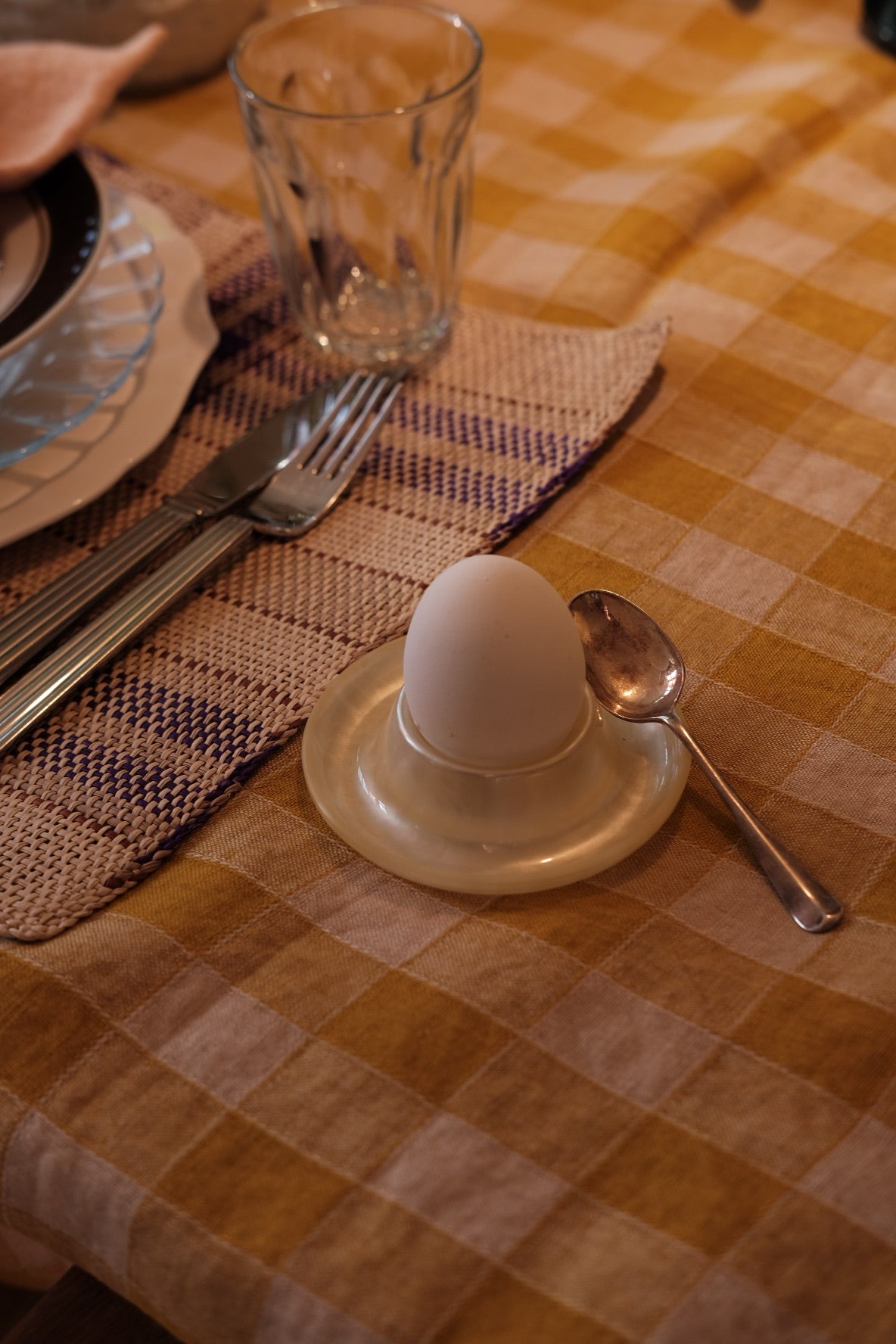 Cream-colored Heim Söhne egg cup with smooth ceramic finish, designed for serving boiled eggs in a stylish breakfast setting.