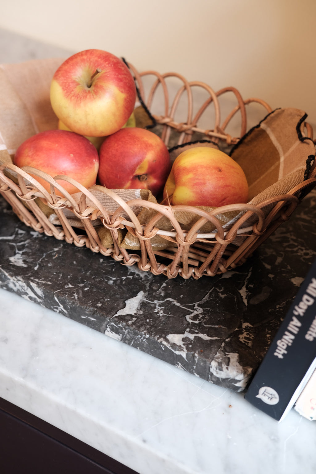 Large rattan bread basket with woven design, ideal for serving bread and baked goods in a rustic kitchen setting.