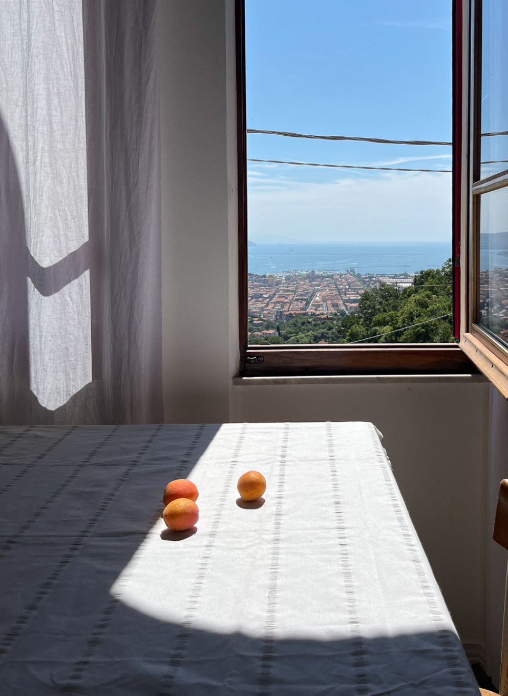 White DORA cotton towel, 180 x 350 cm, soft and absorbent hand towel displayed on a bathroom hook.