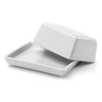 Små smørskål af porcelæn fra DORA, perfekt til smør eller små serveringer, hvidt og elegant design