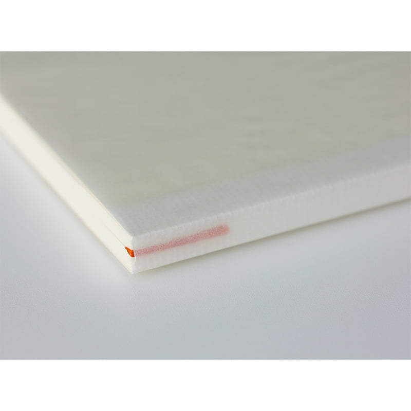 Midori B6 blank notesbook with white pages, compact size for journaling or note-taking.