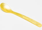 Heim Söhne Ske Lille Lys Gul spoon with yellow handle, close-up view showing details and vibrant yellow color.